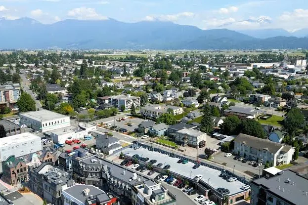 Aerial view of downtown Chilliwack, BC with mountains in the distance
