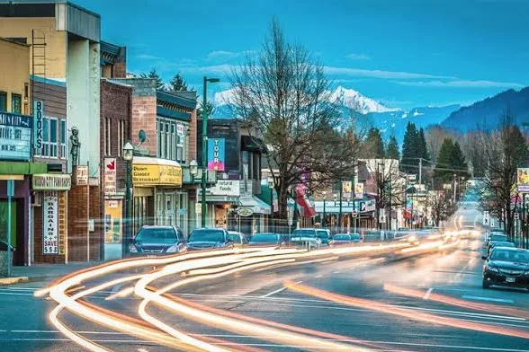 Downtown street in Mission, BC with mountains behind